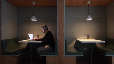 Businessman working late at night in office alone