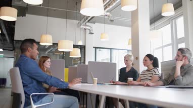 Business colleagues in a morning meeting with coffee