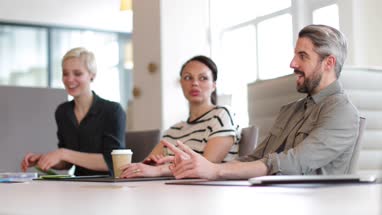 Business colleagues in a morning meeting with coffee