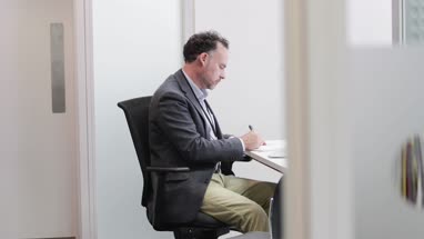 Male Medical Doctor working in his office