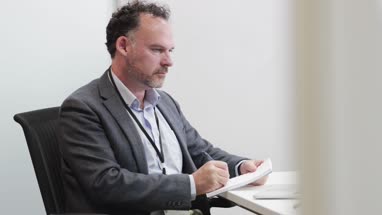 Male Medical Doctor working in his office