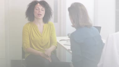 Female Medical Doctor listening to patient symptoms