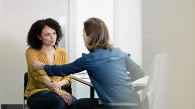 Female Medical Doctor listening to patient symptoms
