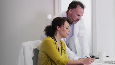 Medical Doctors discussing patient treatment together