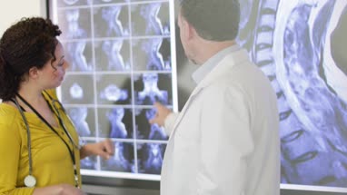 Medical Doctors discussing patient treatment together