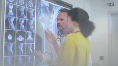 Medical Doctors discussing patient treatment together