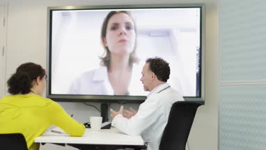 Medical Doctors on a video conference call with specialist
