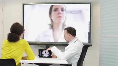 Medical Doctors on a video conference call with specialist