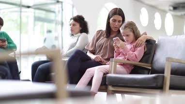 Women waiting in a crowded hospital waiting room 