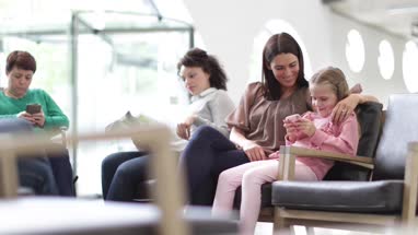 Women waiting in a crowded hospital waiting room 
