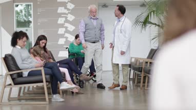 Medical Doctor taking Senior patient through to treatment