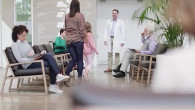 Medical Doctor taking Mother with Daughter through to treatment