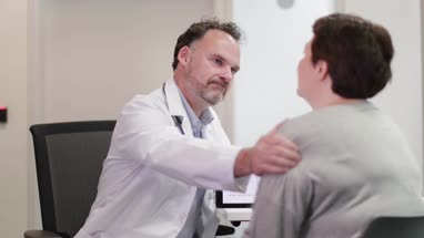 Male Medical Doctor explaining test results to patient
