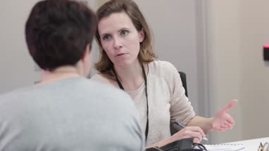 Female Medical Doctor writing prescription for a patient