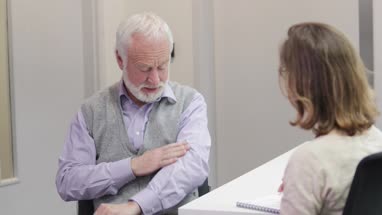 Female Medical Doctor listening to a Senior patient symptoms
