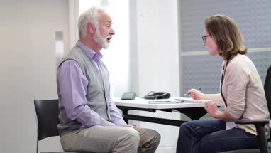Female Medical Doctor listening to a Senior patient symptoms
