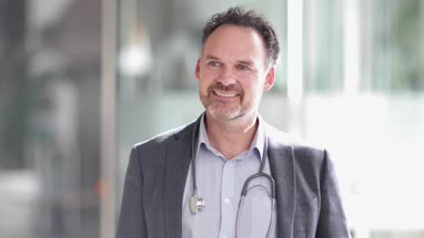 Portrait of Male Doctor in Hospital entrance