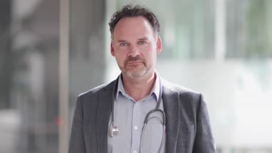 Portrait of Male Doctor in Hospital entrance