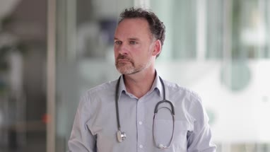 Portrait of Male Doctor in Hospital entrance