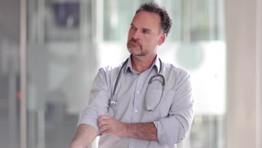 Portrait of Male Doctor in Hospital entrance