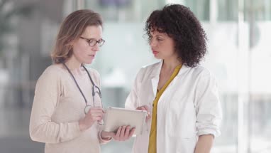 Medical Doctors discussing patient treatment together