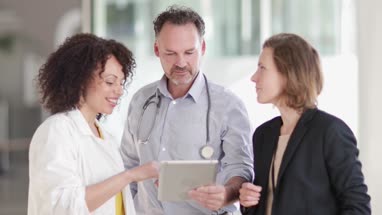 Medical Doctors discussing successful treatment of a patient