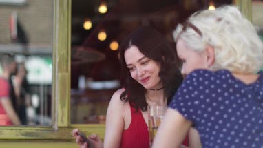 Tourists taking a selfie in a London Pub