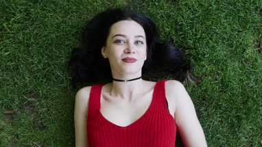 Overhead shot of female sunbathing in park