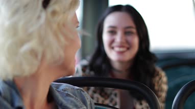 Young adult females arriving on bus