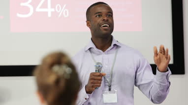 Male executive leading a training conference