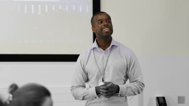 Male executive leading a training conference