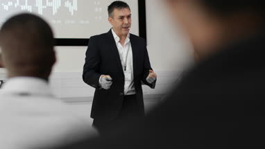 Speaker at business conference demonstrating new technology