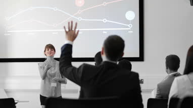 Young female executive speaking at a conference