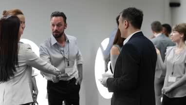Business executives shaking hands at a networking event