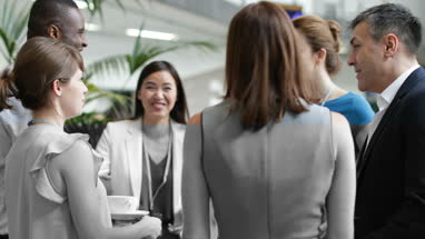 Business executives shaking hands at a networking event