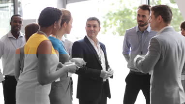 Business executives shaking hands at a networking event