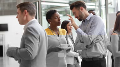 Business executives shaking hands at a networking event