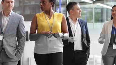 Business team walking through office reception