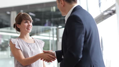 Young female businesswoman being offered a job