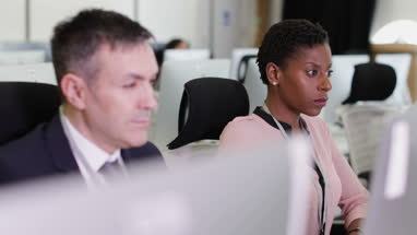 Businesswoman using computer in office