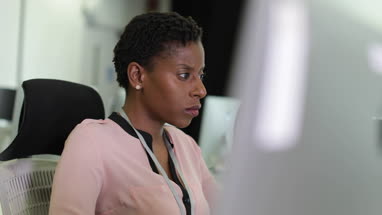 Businesswoman using computer in office
