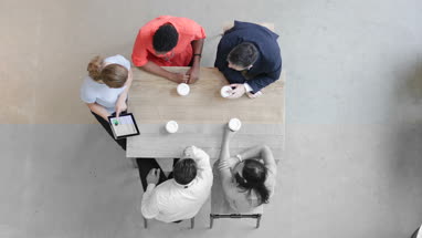 Overhead shot of a presentation in business meeting
