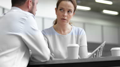 Businesswoman in a meeting using a digital tablet