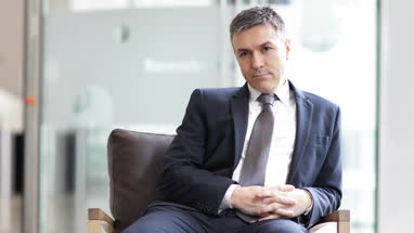 Businessman looking out of window 