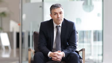 Businessman looking out of window 