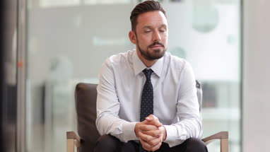 Businessman looking confidently to camera