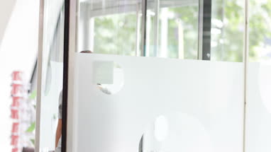 Businesswoman arriving at corporate office reception for a meeting