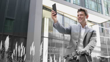 Male cyclist taking a selfie