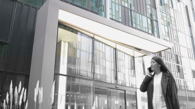 Woman using smartphone walking in city