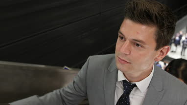 Businessman on escalator 